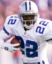 Pro Football Hall of Famer Emmitt Smith wearing number 22 for the Dallas Cowboys rushing the ball