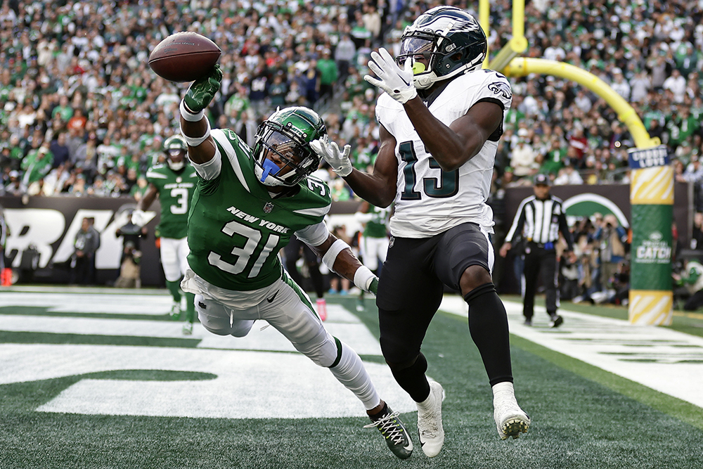 The image “Pass Break Up” shows New York Jets cornerback Craig James deflecting a pass intended for Philadelphia Eagles wide receiver Olamide Zaccheaus in the end zone during the teams’ game at MetLife Stadium in East Rutherford, N.J.