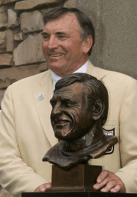 Dave Wilcox poses with his bust, July 29, 2000