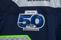 The Seahawks’ patch features two shades of blue-royal blue.