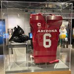 James Conner’s No. 6 red jersey and red pants, along with his cleats are on display in the Pro Football Today Gallery at the Hall of Fame.