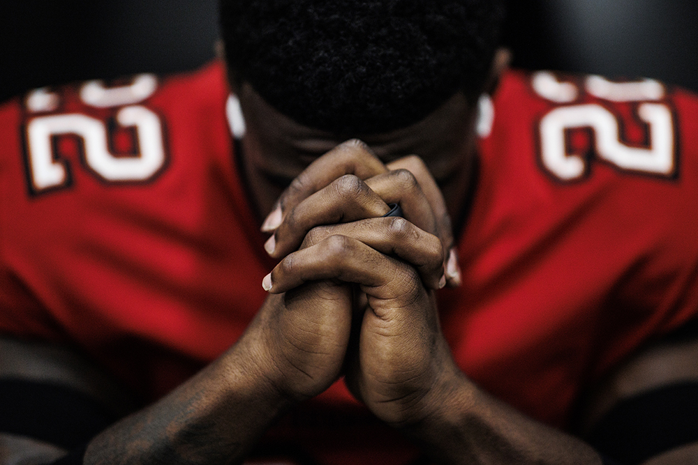 Honorable Mention, Feature – Photo by Kyle Zedaker, Tampa Bay Buccaneers, “22 Prayers,” Tampa Bay Buccaneers at Carolina Panthers, Oct. 23, 2022.