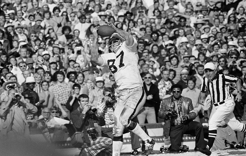 Hall of Fame tight end Dave Casper catches the football.