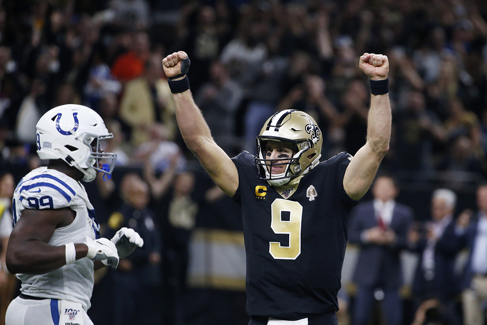 New Orleans Saints quarterback Drew Brees celebrates his touchdown pass to tight end Josh Hill, which broke the NFL record for career touchdown passes.