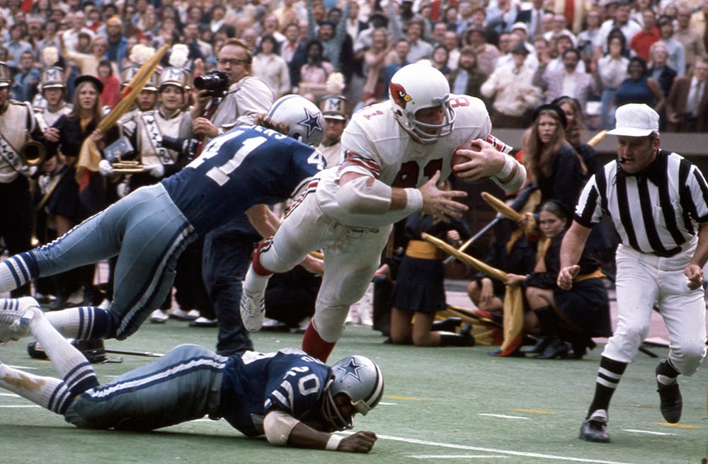 Hall of Fame tight end Jackie Smith carries the football.
