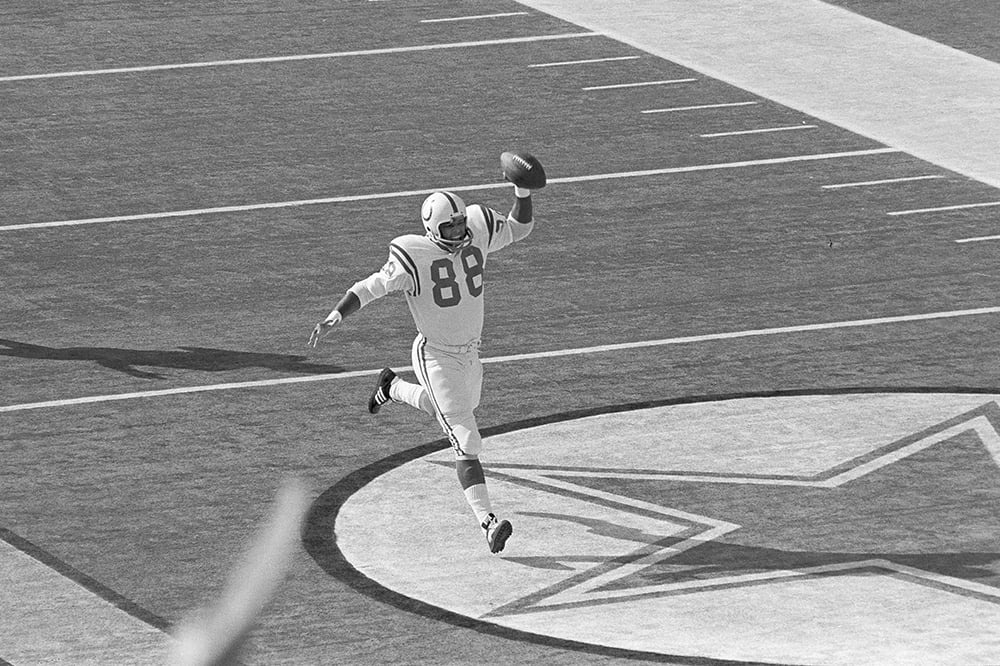 Hall of Fame tight end John Mackey carries the football.