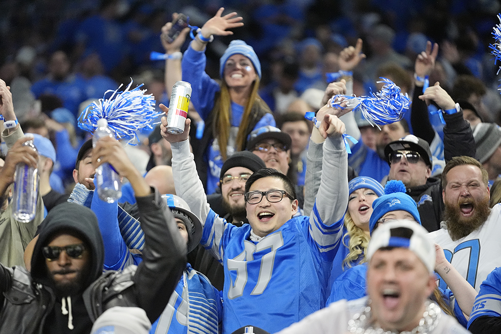 Lions fans celebrate a touchdown during the team's 2023 playoff win over the Rams.